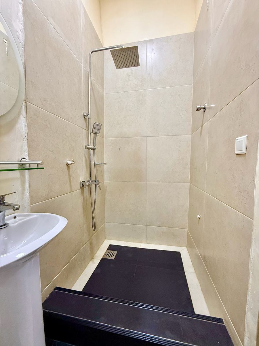 Economy studio suite, Studio suite bathroom with walk-in rain shower