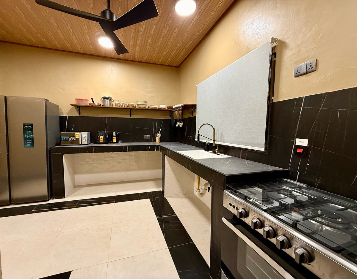 Luxury 1 bedroom, Kitchen with gas stove, sink and refrigerator