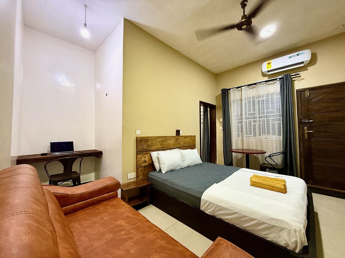 Superior queen studio suite, desk, sofa and bed